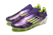 Pair of purple adidas F50 laceless soccer cleats with lime stripes and studded soles.