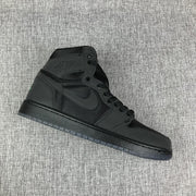Side profile of the black high-top sneaker showing its layered panel construction.