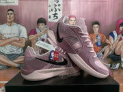Angled view of pink Nike basketball sneakers showing the side Swoosh, laces, textured panels and padded collar.