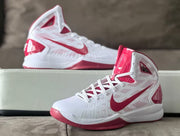 Pair of white and red high-top basketball shoes in side and three-quarter views.