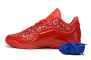 Side profile of a red Nike LeBron 23 basketball shoe with patterned upper and blue laces.