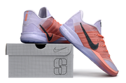 Purple and coral Nike Sabrina 3 shoes displayed with a shoe box