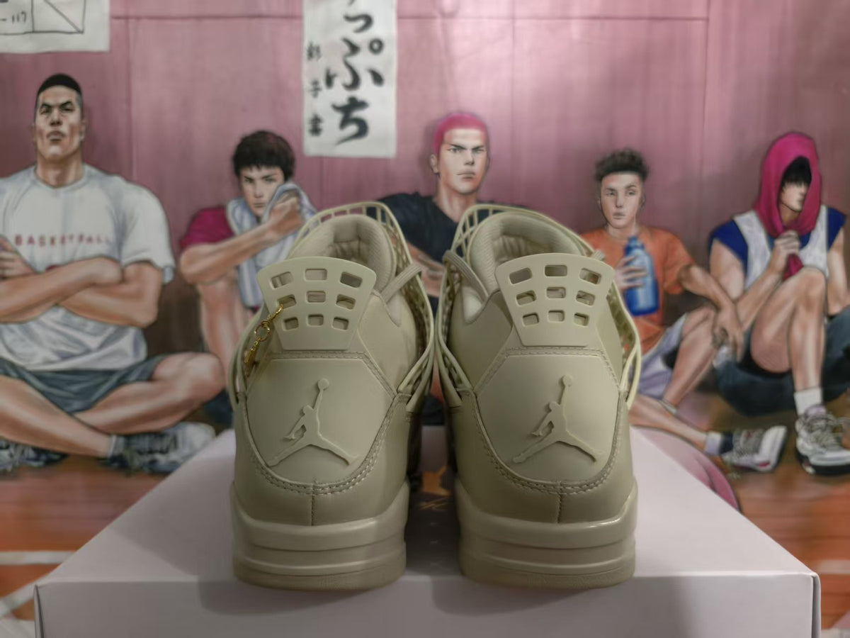Rear view of warm yellow Jordan sneakers showing the Jumpman logos, molded heel panels, and padded collars.
