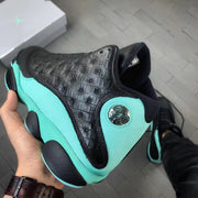 Close-up of the textured black upper and green side panel