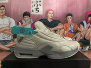 Side profile of a beige sneaker with gray accents and a visible heel cushioning window