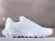 Opposite side view of a white Alo sneaker with lace-up fastening.
