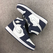 Pair of sneakers displayed diagonally to show the high-top profile and contrast panels.