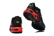 Rear and outsole views of black and red Nike Air Max Plus sneakers.