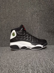 Side profile showing the black upper, white midsole, and circular heel detail
