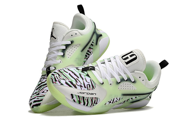 Pair of Jordan Heir shoes in white, black, and pale green with a patterned upper.
