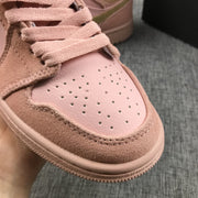 Close-up of the perforated pink toe box, textured surrounding panel, and pink laces.
