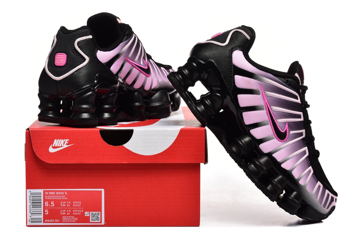Nike Shox TL sneakers in black and pink displayed with the product box; box label shows style code IH4485-001 and a sample size.