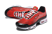 Pair of red and black Nike Air Max Plus sneakers viewed from above and at an angle