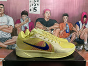 Side profile of a yellow Nike basketball sneaker with blue Swoosh branding, red panel accents, and a sculpted midsole.