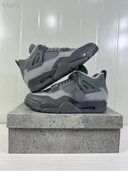 Angled product view showing the grey upper, dark midsole, and visible outsole edge.