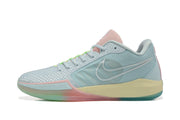 Side profile of a pastel blue Nike basketball shoe with a Swoosh logo and pale yellow midsole accent.