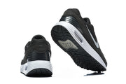 Rear and outsole views of black and white Nike Air Max Verse sneakers.