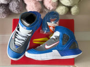 Pair of blue and gray high-top sneakers shown from the side and top on a red box.