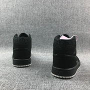Rear view of the pair showing the black heel panels and white outsole sections.