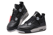 Side view highlighting the textured black upper, perforated panels and speckled grey midsole.