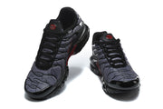 Front views of the black and grey Nike Air Max Plus sneakers.