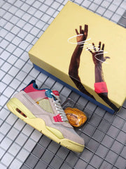Pink, cream, blue, and yellow Air Jordan 4 sneaker beside its illustrated shoebox and spare laces.