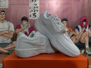 White Nike basketball shoes shown from the side and at an angle