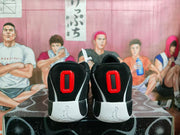 Rear view showing black padded collars, red heel details, white midsoles, and embossed Jordan logos.