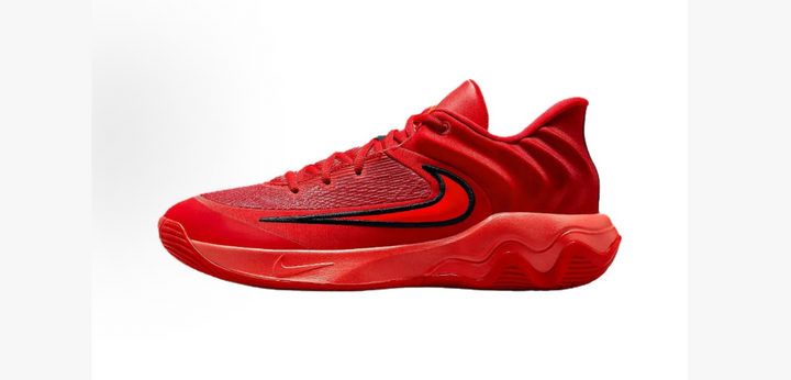 Side view of red Nike basketball shoes with a black-outlined Swoosh and sculpted red sole