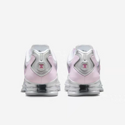 Rear view of white and pale pink Nike Shox TL-style sneakers.