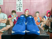 Front view of the blue basketball sneakers showing matching blue laces, textured toe boxes and Kobe 8 tongue emblems.