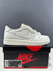 Side view of a white low-top Jordan sneaker displayed on a branded shoe box; the box label shows UK 7, BR 39.5, EUR 41, CM 26, and style code HQ6998 100.