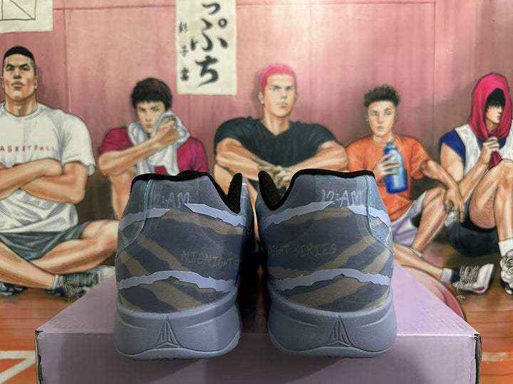 Rear view of blue-gray camouflage Nike basketball shoes with gray heels