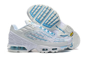 Nike Air Max Plus sneakers shown from the side and outsole, highlighting blue sole accents and visible cushioning.