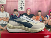 Side view showing the PUMA Rider Elite name and layered upper