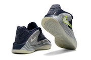 Navy and gray Nike Giannis Immortality 7 shoes showing heel and outsole details