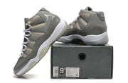 High-top sneakers arranged on a shoe box to show the side, heel, laces, and translucent outsole.