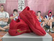 Angled view of the red sneakers showing the Jordan side logo, gold accent panel, and layered outsole.