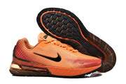 Orange Nike sneakers shown with the black outsole visible.