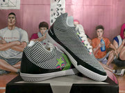 Angled side view showing the patterned uppers, black overlays, multicolor star detail, and white soles.