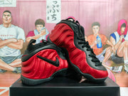 Angled view showing the sculpted red side panels, black swoosh, black collar, and textured outsole.