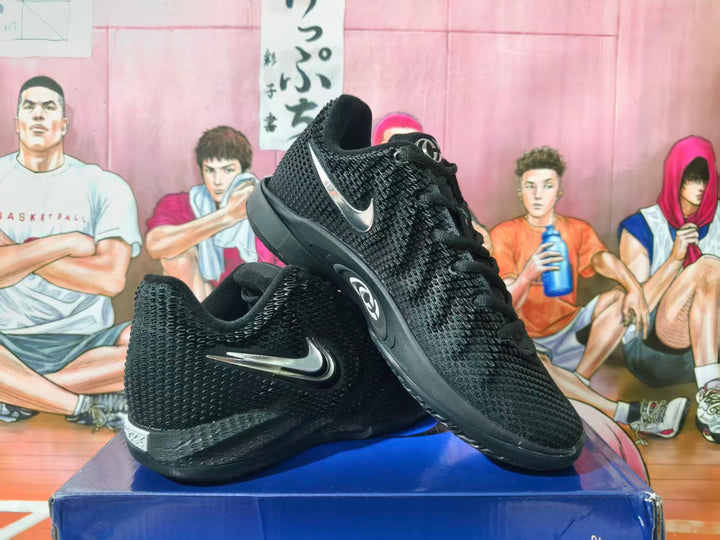 Pair of black Nike basketball sneakers with silver-tone Swoosh details, shown at an angle.