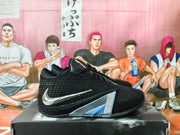 Side view of a black Nike basketball shoe with silver Swoosh and blue-silver side detailing.