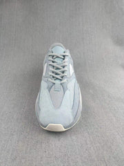 Top-down view showing the lace-up construction, mesh tongue, layered toe panels, and rounded toe shape.