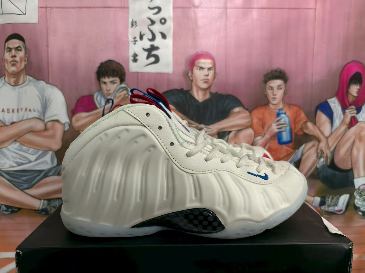 Side view of a white high-top sneaker with sculpted side panels, blue accents, and a dark outsole insert.