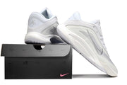 White and silver Nike A'ja Wilson 1 shoes arranged with a branded shoebox.