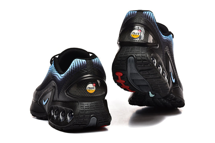 Rear and outsole views of black and blue Nike sneakers