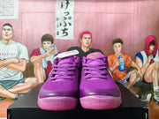 Front view of purple Nike sneakers with lace-up closures and translucent pink-purple outsole sections.