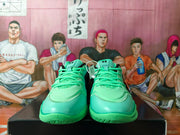 Front view showing the green toe boxes, green laces, and textured forefoot outsole