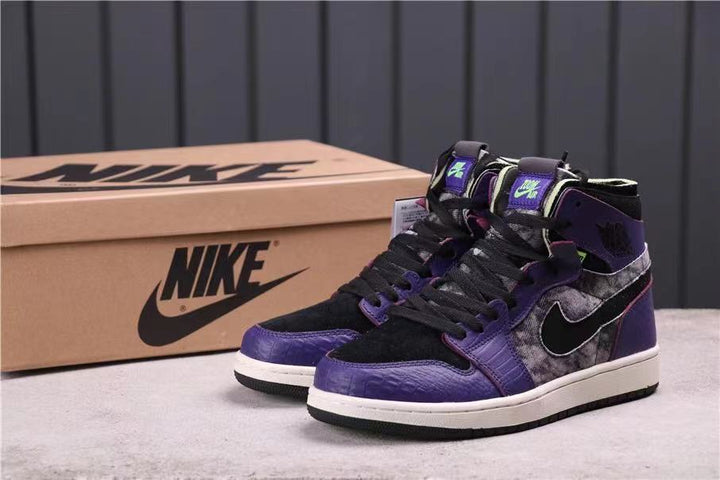 Pair of black and purple high-top sneakers displayed beside a Nike shoebox.